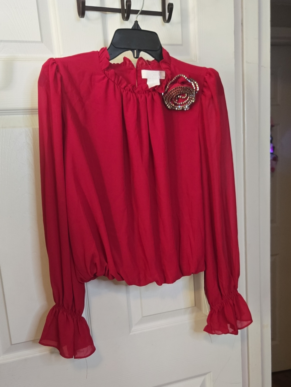 Women’s Red Long-Sleeve Ruffle Blouse with Decorative Brooch
